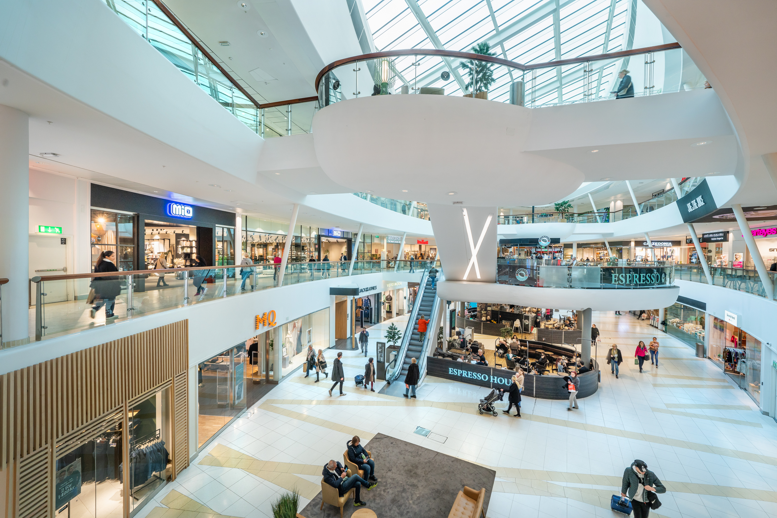 Shoppers in the atrium of Täby Centrum shopping centre